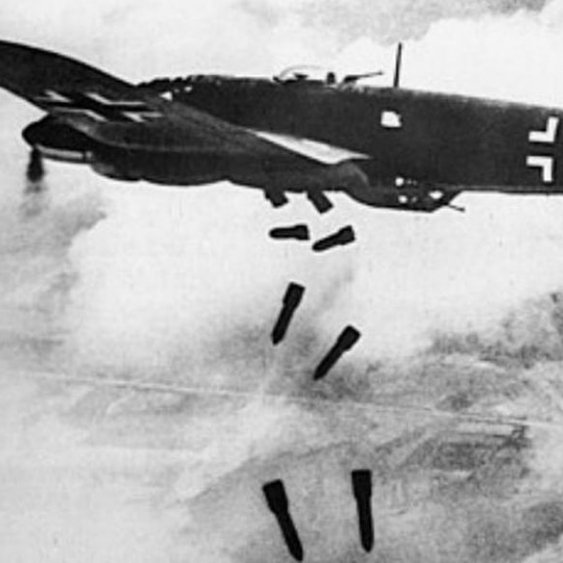 Een Duitse Heinkel bommenwerper werpt zijn bommen af